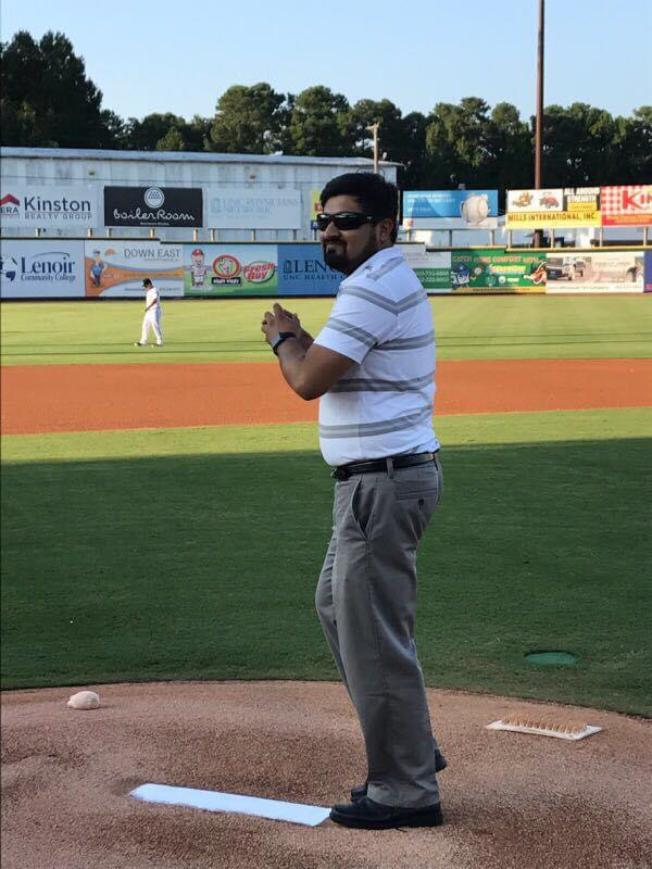 Sultan M. Babar throwing at first pitch at the Down East Wood Ducks on August 17, 2017